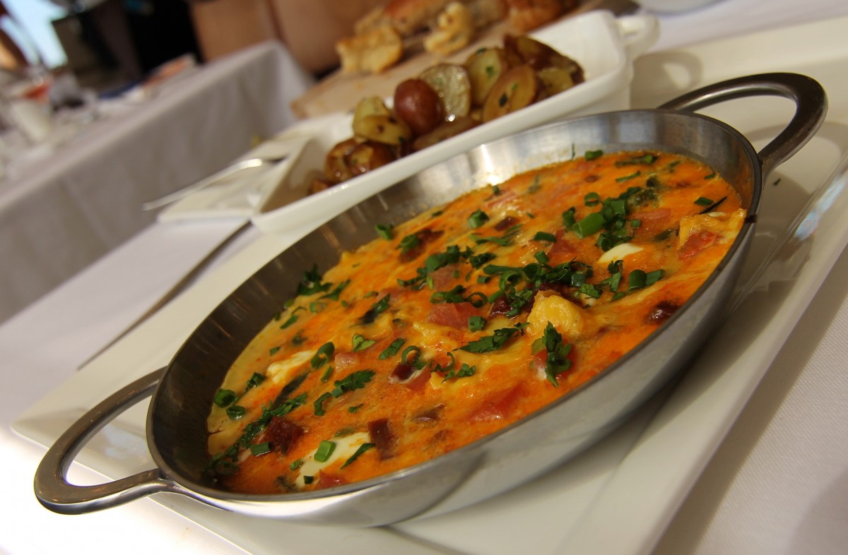 Chef's fritttata with heirloom tomatoes, roasted poblano peppers, chorizo, and goat cheese served with marble potatoes