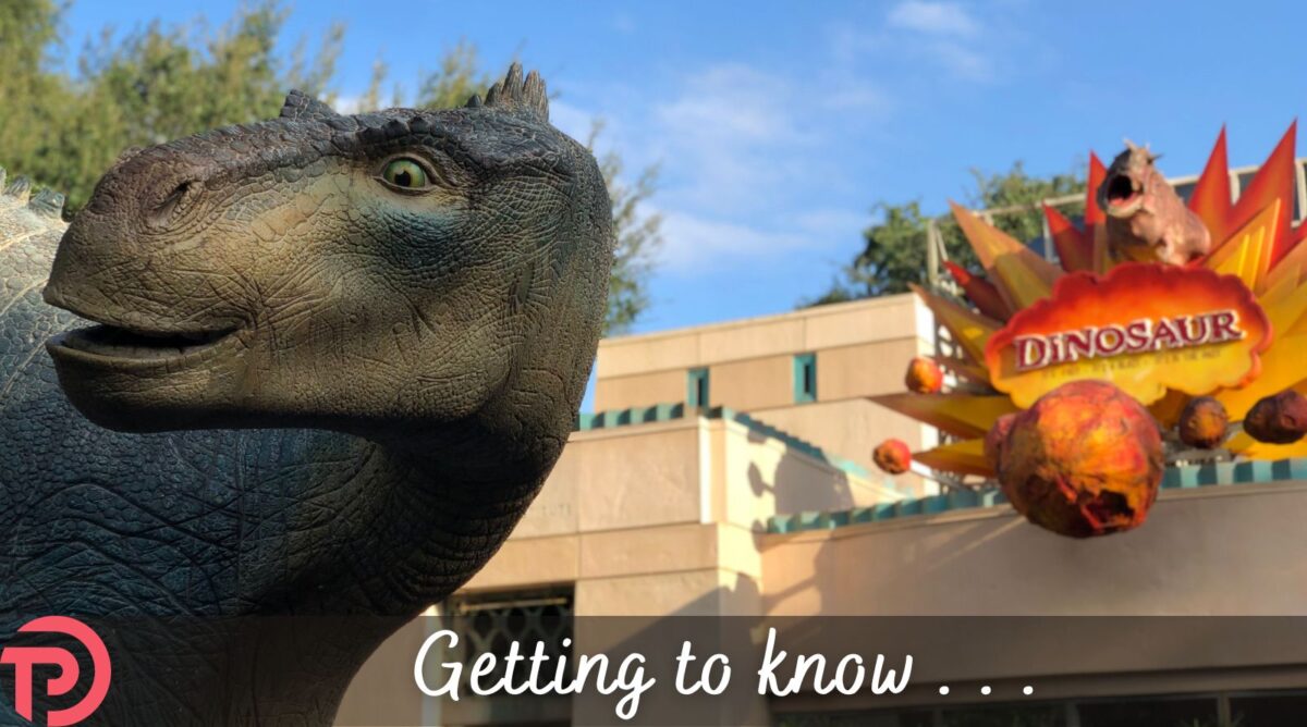 Getting to Know DINOSUAUR cover image showing the head of a dinosaur statue with the ride's sign in the background.
