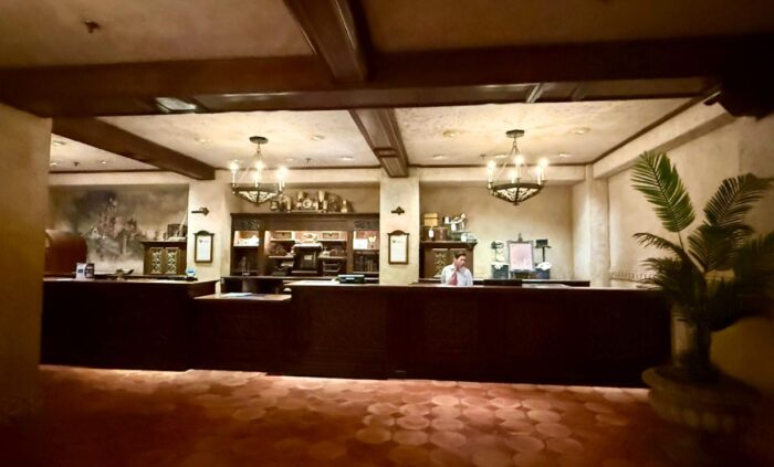 A clerk sits at a "vintage" lobby desk